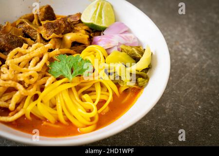 Northern Thai noodle curry soup with braised pork - Thai food style Stock Photo