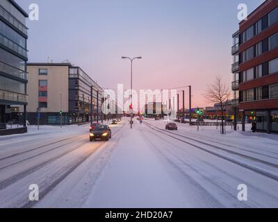 Turku, Finland - December 24, 2021: Horizontal Closeup Snowy View of Raisiontie Street in Turku, Finland. Stock Photo