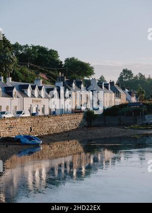 The summer village of Plockton on Loch Carron in Lochalsh, Wester Ross, West Highlands Scotland UK - Scottish coast coastline village scenic Stock Photo