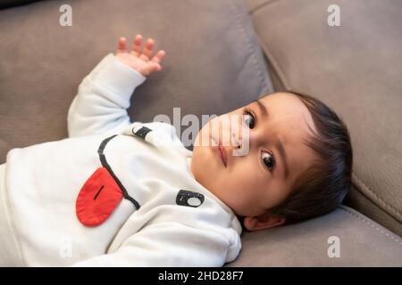 Baby crying with the pain of his first teeth Stock Photo