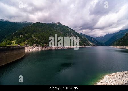 Dam of the Lago del Sambuco, a water reservoir in the upper part of the Maggia valley, Valle Maggia. Stock Photo