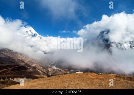 Mount Ama Dablam within clouds, way to Everest base camp, Khumbu valley, Sagarmatha national park, Everest area, Nepal Stock Photo