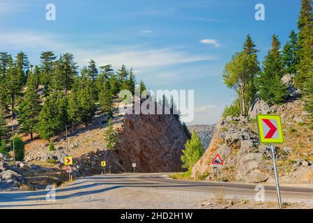 Road bend in mountains of Turkey at sunset Stock Photo