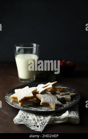 Christmas cookies. Biscuits with shortcrust pastry on wooden background. Christmas and holiday season. Stock Photo