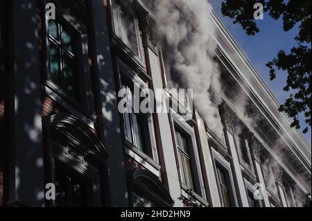 South Africa's national parliament smouldering after a fire broke out in the early hours of 2 January 2022 in central Cape Town Stock Photo