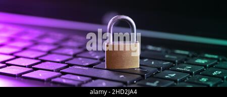 Cybersecurity concept, padlock on laptop computer keyboard. Stock Photo