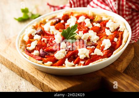 Savory pie with olives, roasted pepper and cheese Stock Photo