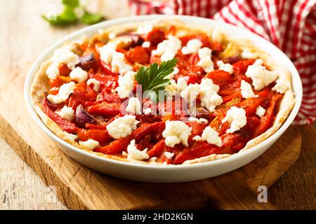 Savory pie with olives, roasted pepper and cheese Stock Photo