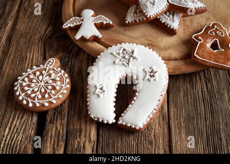 Horseshoe and other homemade Christmas gingerbread cookies on a table Stock Photo