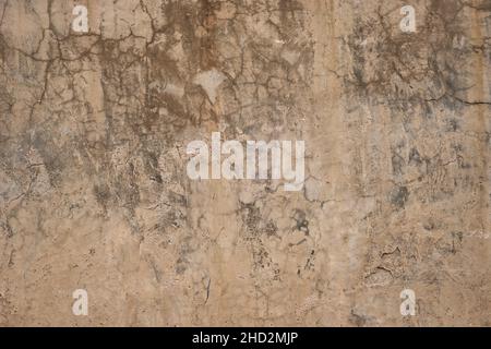 Old weathered limewash wall with damp Stock Photo