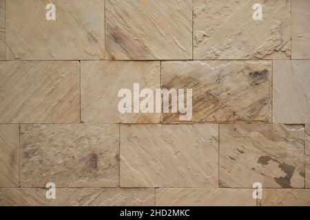 Ceramic porcelain stoneware tiles wall with textured natural sandstone finish Stock Photo