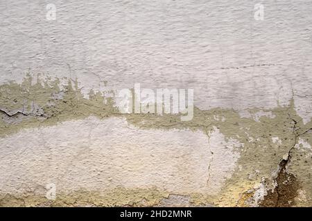 Old whitewashed wall with damp Stock Photo