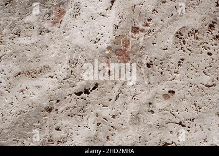 Classic travertine stoneware porcelain tiles, rustic natural stone effect, porous limestone texture detail Stock Photo