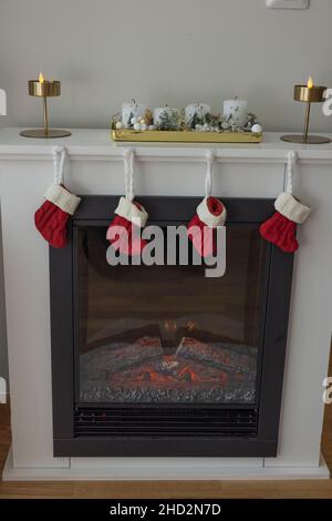 Beautiful view interior of electric fireplace isolated on wall background. Sweden. Stock Photo