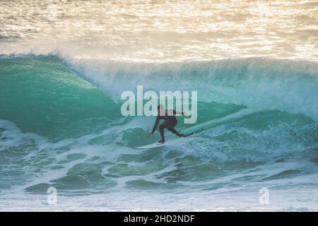 Surfer in a perfect barrel wave. Stock Photo