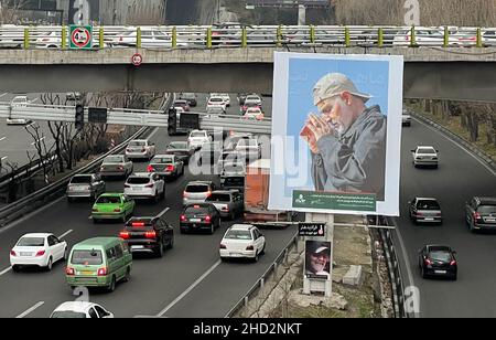 (220102) -- TEHRAN, Jan. 2, 2022 (Xinhua) -- Vehicles drive past a billboard showing late Iranian General Qassem Soleimani in Tehran, Iran, on Jan. 2, 2022, one day ahead of the second anniversary of his assassination by the United States in Iraq. Iran's Foreign Ministry said on Sunday that the U.S. assassination of the country's top general two years ago has raised 'hatred' in global opinion. A U.S. airstrike on Jan. 3, 2020 killed Soleimani, former commander of the Quds Force of Iran's Islamic Revolution Guards Corps, along with an Iraqi militia commander, near the Baghdad International Airp Stock Photo