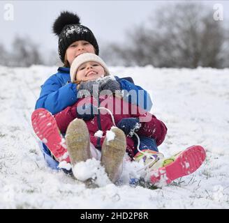 Pictured: Sisters Kerry Anne (7) and Jessica McBeth (9) from Armadale have some fun in the snow.  The first falls of snow in central Scotland meant fun in the snow for kids in Armadale, West Lothian.  (c) Dave Johnston Stock Photo