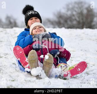 Pictured: Sisters Kerry Anne (7) and Jessica McBeth (9) from Armadale have some fun in the snow.  The first falls of snow in central Scotland meant fun in the snow for kids in Armadale, West Lothian.  (c) Dave Johnston Stock Photo