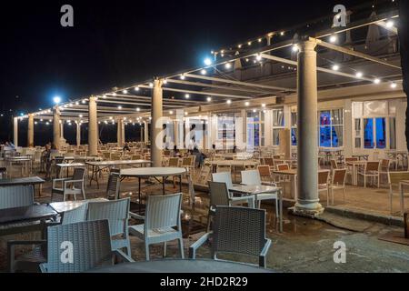 Malaga, Andalucia, Spain. June, 2021.  Night view of a terrace of a restaurant on the seafront on the coast of the capital of Malaga. Stock Photo