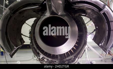Engine of the airplane under heavy maintenance. Aircraft maintenance, dismantled plane engine. Chassis of the airplane under heavy maintenance 4K Stock Photo