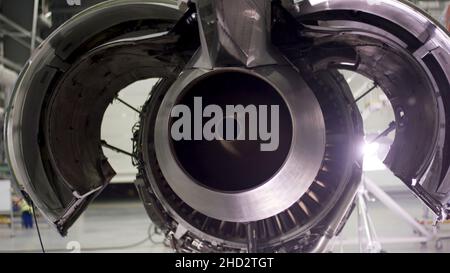 Engine of the airplane under heavy maintenance. Aircraft maintenance, dismantled plane engine. Chassis of the airplane under heavy maintenance 4K Stock Photo