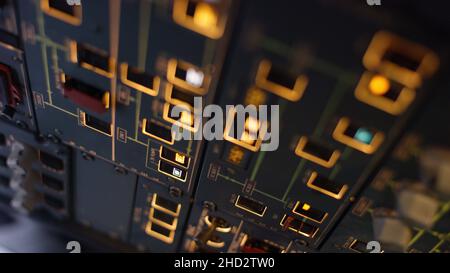 Autopilot control element of an airliner. Panel of switches on an aircraft flight deck. Thrust levers of a twin engined airliner. Pilot controls the a Stock Photo