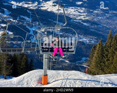 Women on chair lift in french alps, Europe Stock Photo