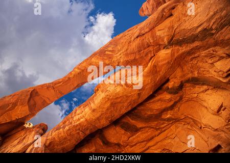 Unnamed arch and summer sky near Tower Arch in Arches National Park Stock Photo