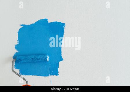 Someone painting wall Stock Photo