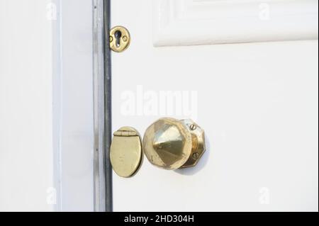 Brass door handle and key hole on victorian door Stock Photo
