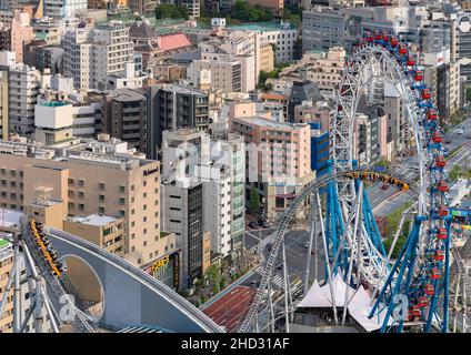 tokyo, japan - may 03 2021: Bird's eye view the steel roller coaster Thunder Dolphin and the centerless non-rotating Ferris wheel Big-O above the shop Stock Photo