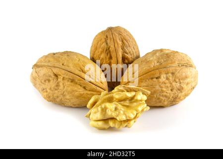 Walnuts isolated on white background. The fruits of the nut are whole and peeled Stock Photo