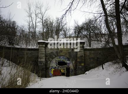 The abandoned Merriton Tunnel aka Blue Ghost Tunnel or Grand Trunk Railway Tunnel at night in the winter. Ontario, Canada. Stock Photo