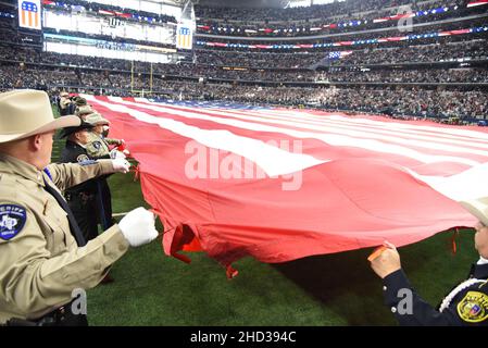 Arlington, United States. 02nd Jan, 2022. Law enforcement officers display the American Flag prior to the Dallas Cowboys and Arizona Cardinals during their NFL game at AT&T Stadium in Arlington, Texas on Sunday, January 2, 2022. Photo by Ian Halperin/UPI Credit: UPI/Alamy Live News Stock Photo
