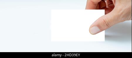 Hand holding  pitted dates isolated on white background Stock Photo