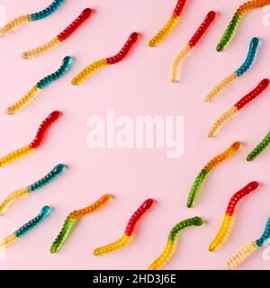 Gummy candies pattern on bright pink background with copy space. Minimal food concept with flat lay view. Stock Photo