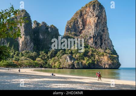 Early morning at Railay Beach West, one of the most famous beaches in Thailand. It is located on a peninsula Rai Leh and only accessible by boat. Stock Photo