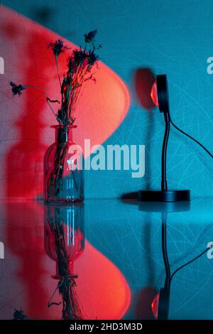 Sunset projector lamp on the table. Multi colored RGB light. Home decor. Selective focus Stock Photo