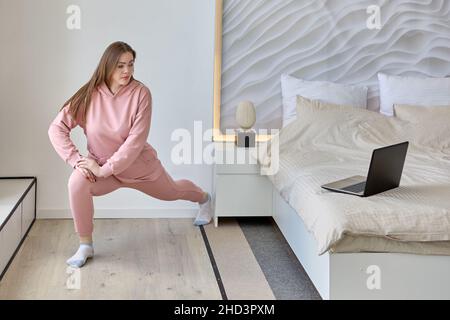 Live streaming virtual classes using laptop by woman indoors. Stock Photo