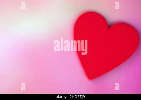 Red Heart with soft blurred pink background, Valentines Day concept, romantic greeting card Flat lay background with copy space Stock Photo