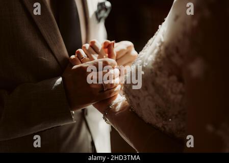 Bride and groom holding hands Stock Photo