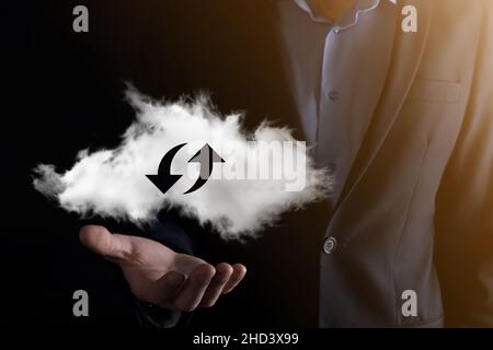 Cloud technology. Polygonal wireframe cloud storage sign with two arrows up and down on dark . Cloud computing, big data center, future infrastructure Stock Photo