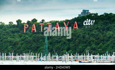 Pattaya City Signage in Thailand on a hillside with green trees. Stock Photo