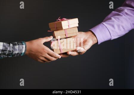 men hand giving homemade gift box  Stock Photo