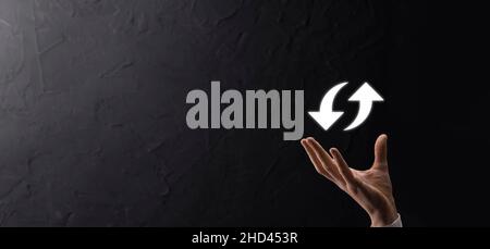 Cloud technology. Polygonal wireframe cloud storage sign with two arrows up and down on dark . Cloud computing, big data center, future infrastructure Stock Photo