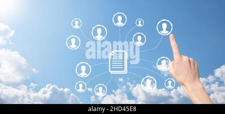 Man hold document and user icon.Corporate data management system DMS and document management system concept. Businessman click or publish on document Stock Photo