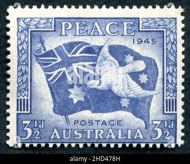 A 1946 issue 3 1/2d Australian postage stamp entitled ‘Peace 1945’ commemorating the end of the Second World War. The stamp was designed by Frank D. Manley and George Lissenden and engraved by Manley. Stock Photo