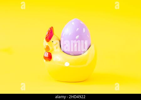 Easter greeting card with decorative chicken and painted egg. Easter concept Stock Photo