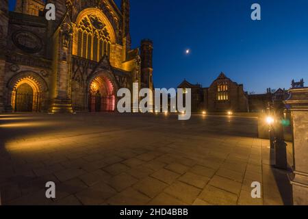 Hereford Cathedral and Chained Library illuminated under the evening sky. Hereford England UK. December 2021 Stock Photo