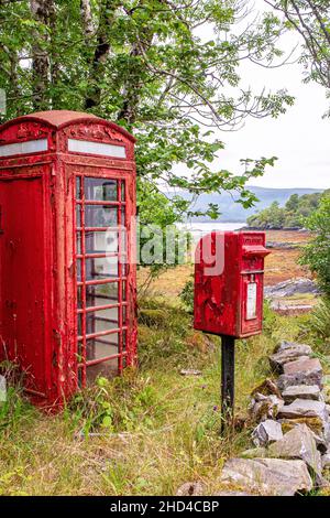 A neglected phone and post box in the highlands of Scotland, in dire need of a repaint. Stock Photo